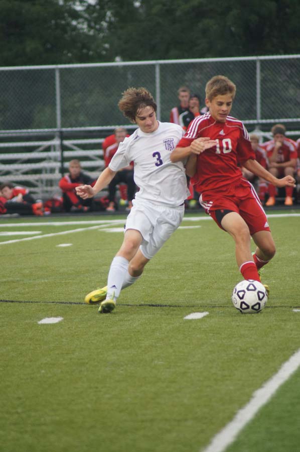Junior Nathan Orel battles a Tonganoxie player for the ball Sept. 18.