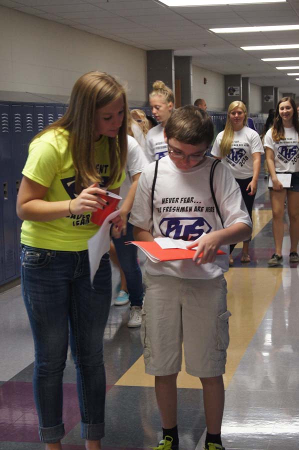 Senior Emily Hankinson helps a freshman read his schedule Aug. 15.