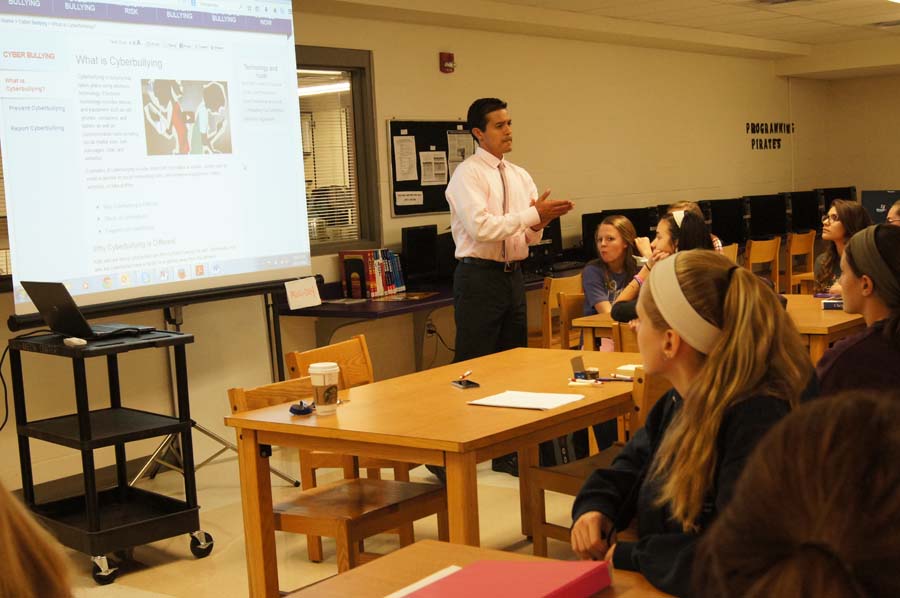 Principal Michael Schumacher shows a website to The Student Leadership Team about bullying. 