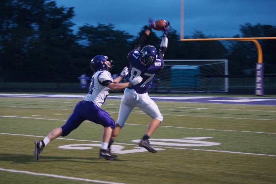 Senior Collin Beebe makes the catch only to be brought down seconds later. 