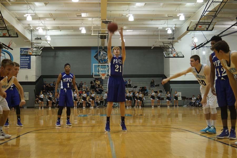 Junior Bryant Rogers shoots a free throw completing the traditional three-point play.