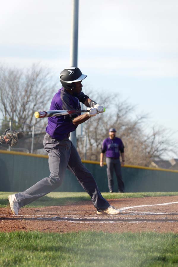 Sophomore Isaiah Washington hits a double to help lead his team to a victory.