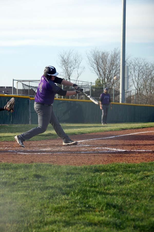 Junior Arron Hawes swings at a high pitch.