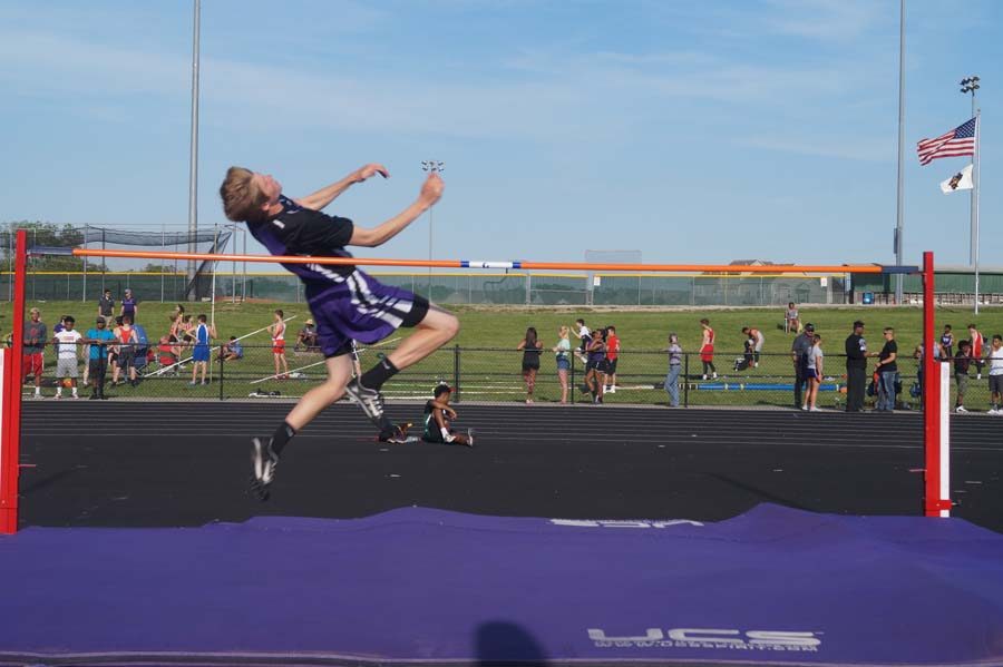 Junior Bryant Rogers takes off to jump over 6ft in high jump. 