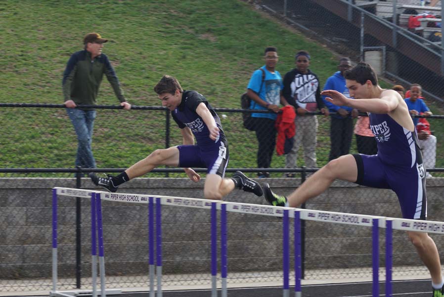 Freshman Dalton White and Junior Dominic Dreger compete in hurdles. 