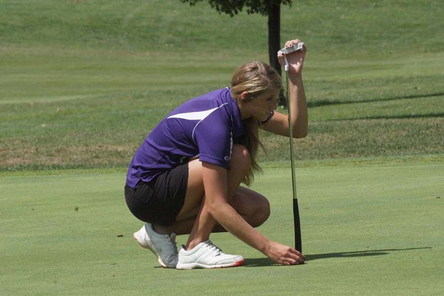 Junior Mary Rogers lines up her ball Sept. 6.