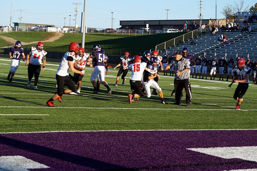 Sophomore Dalton White fights for extra yards on a run. White would score on the play to put the Pirates on the scoreboard first.