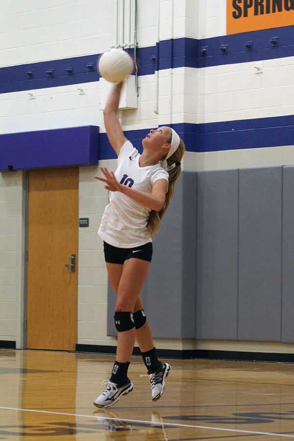 Sophomore Abby Woodall serves to the opposing team.