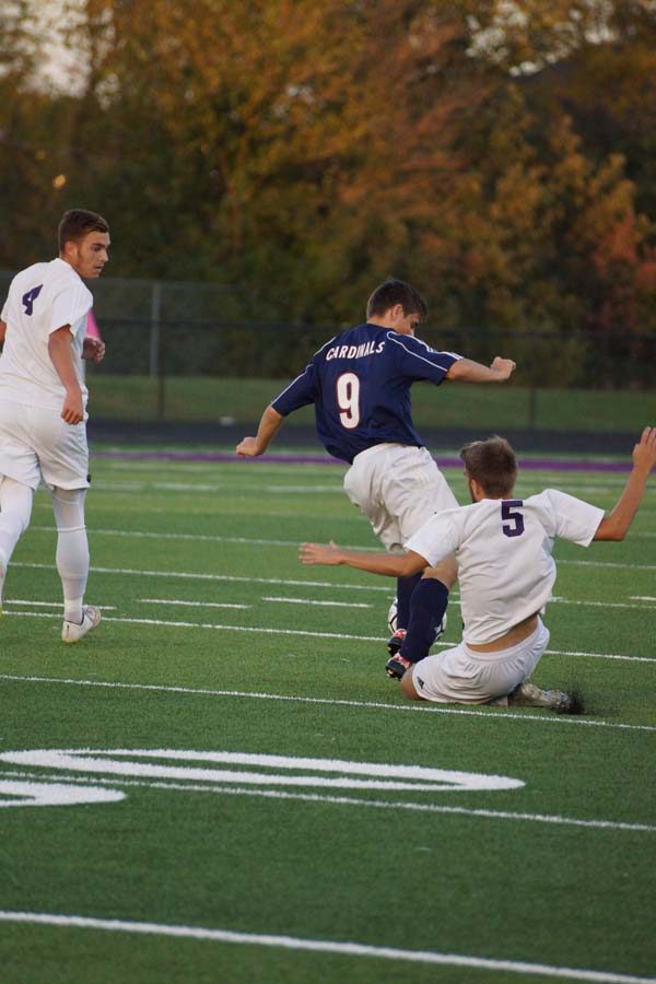 Senior Christian Snell attempts to gain control of the ball from  Eudora Oct 20.