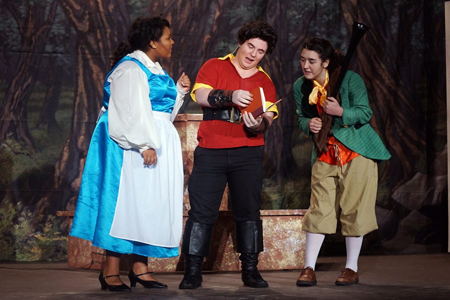 Gaston and his sidekick LeFou (senior Margaret Wolf) tease Belle about reading books. 