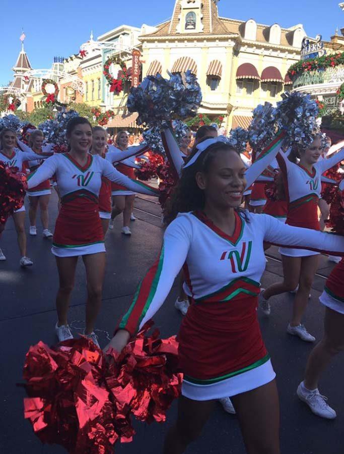 Talia performs alongside fellow All-American cheerleaders in the NCAs Disney Parks parade in Orlando.