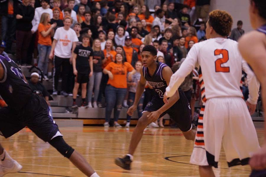 Senior Jalen Taylor hustles to get to the other end of the court.