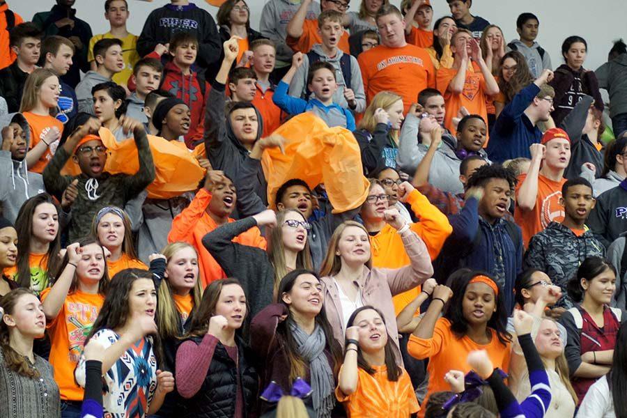Freshman chant their graduation year wearing their class color orange at the pep assembly Feb. 3.