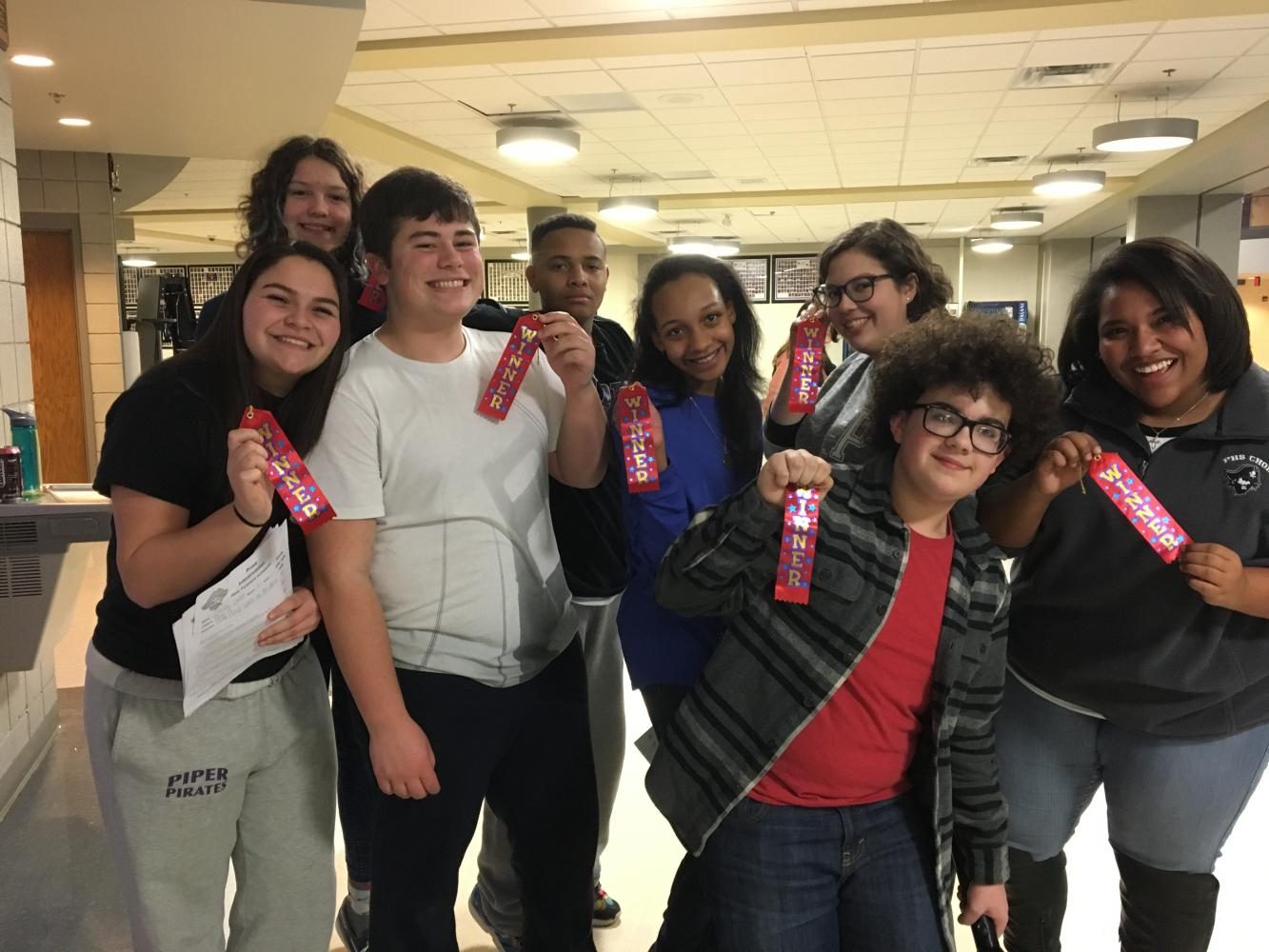 The forensics lock-in Jan. 20 included a mock tournament. These novices took first in their individual events. From left: Olivia Ortiz, Martha Wolf, Drew Novak, Kaulon Eason, Eden Barnes, Emma Bertrand, Trent Smith, and Alena Riley.