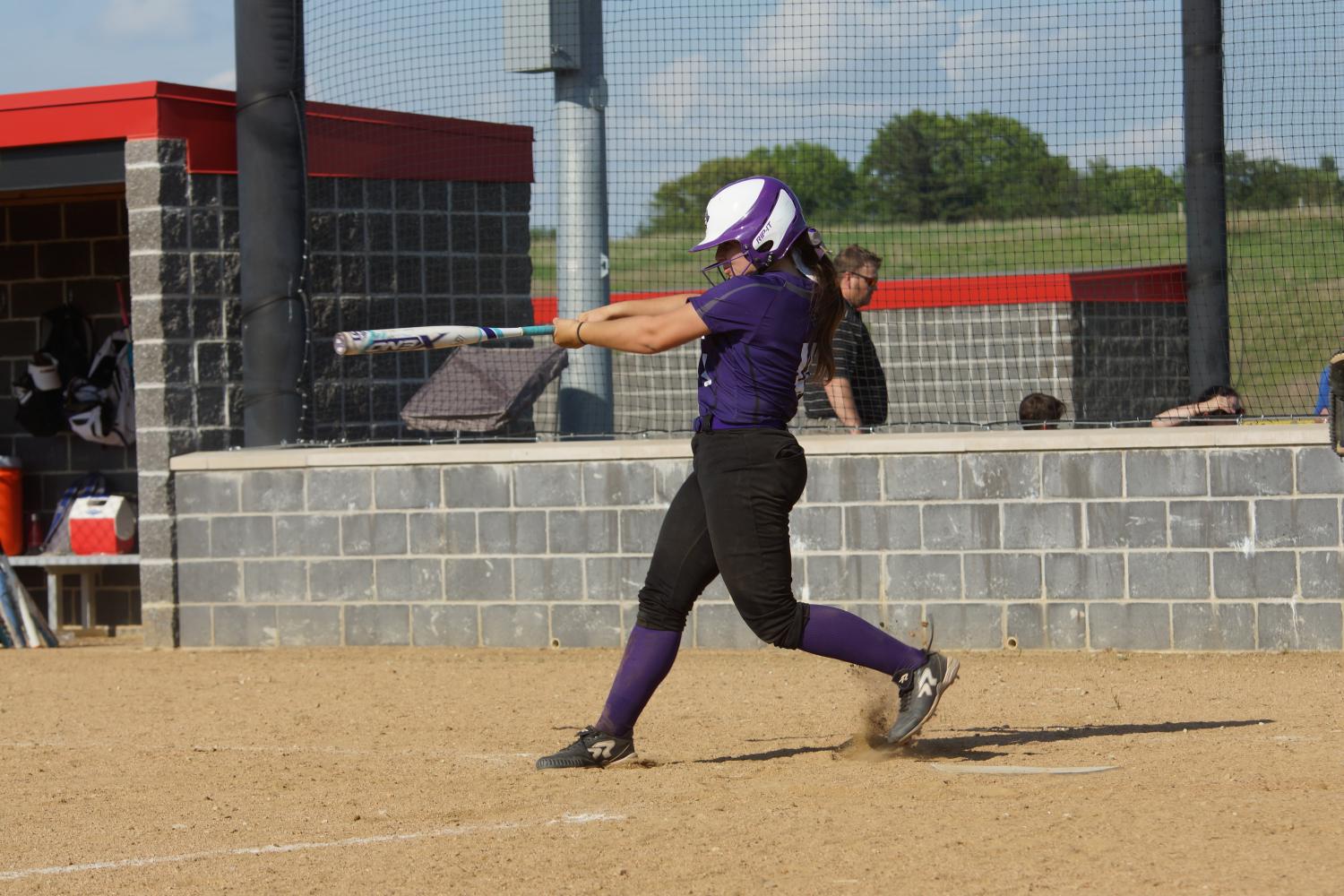 Lauren Pappert swings her bat hitting the ball into the right field gap getting a triple and scoring two run to help the pirates win their game. 