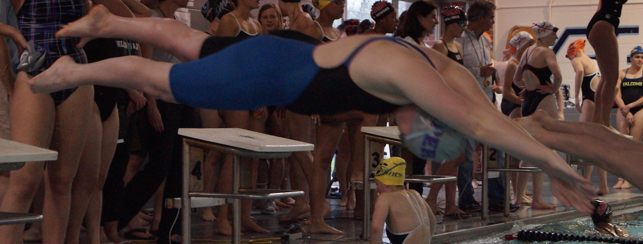 Swimmer Megan Dailey dives into the water at the Shawnee Mission East meet.