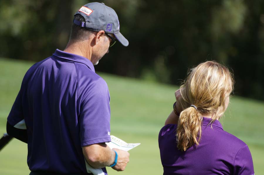 Coach Craig Reed and senior Zoey Zager discuss her scores at Dubs Dread.