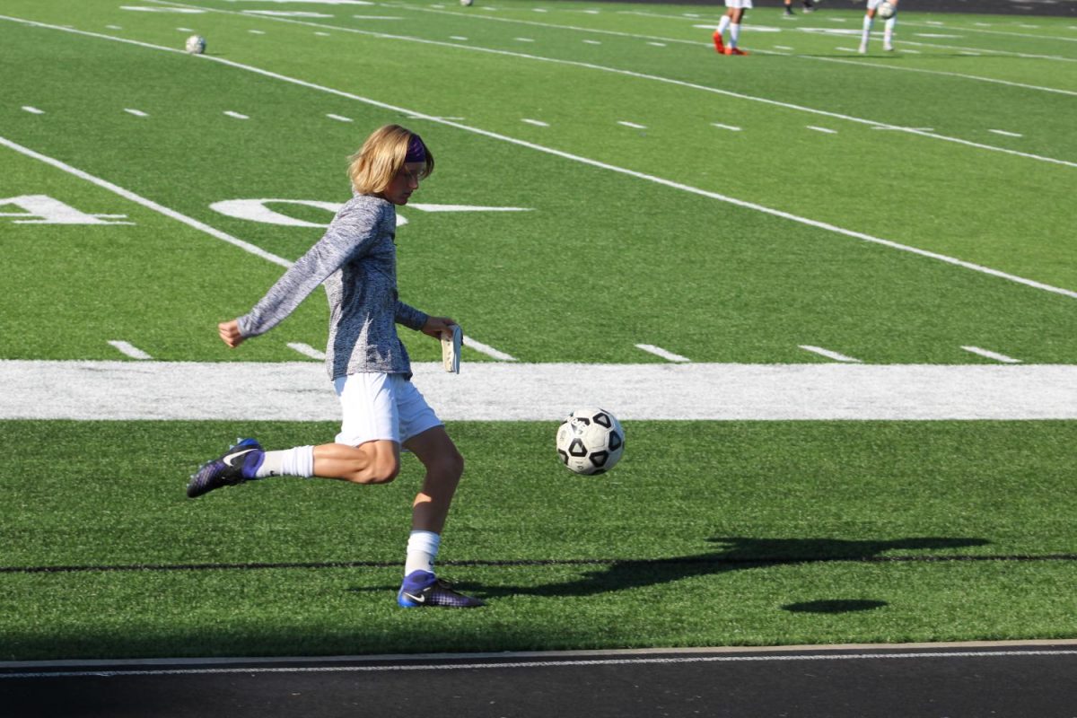 Junior Ronin Richardson passes during a pre-game drill. 