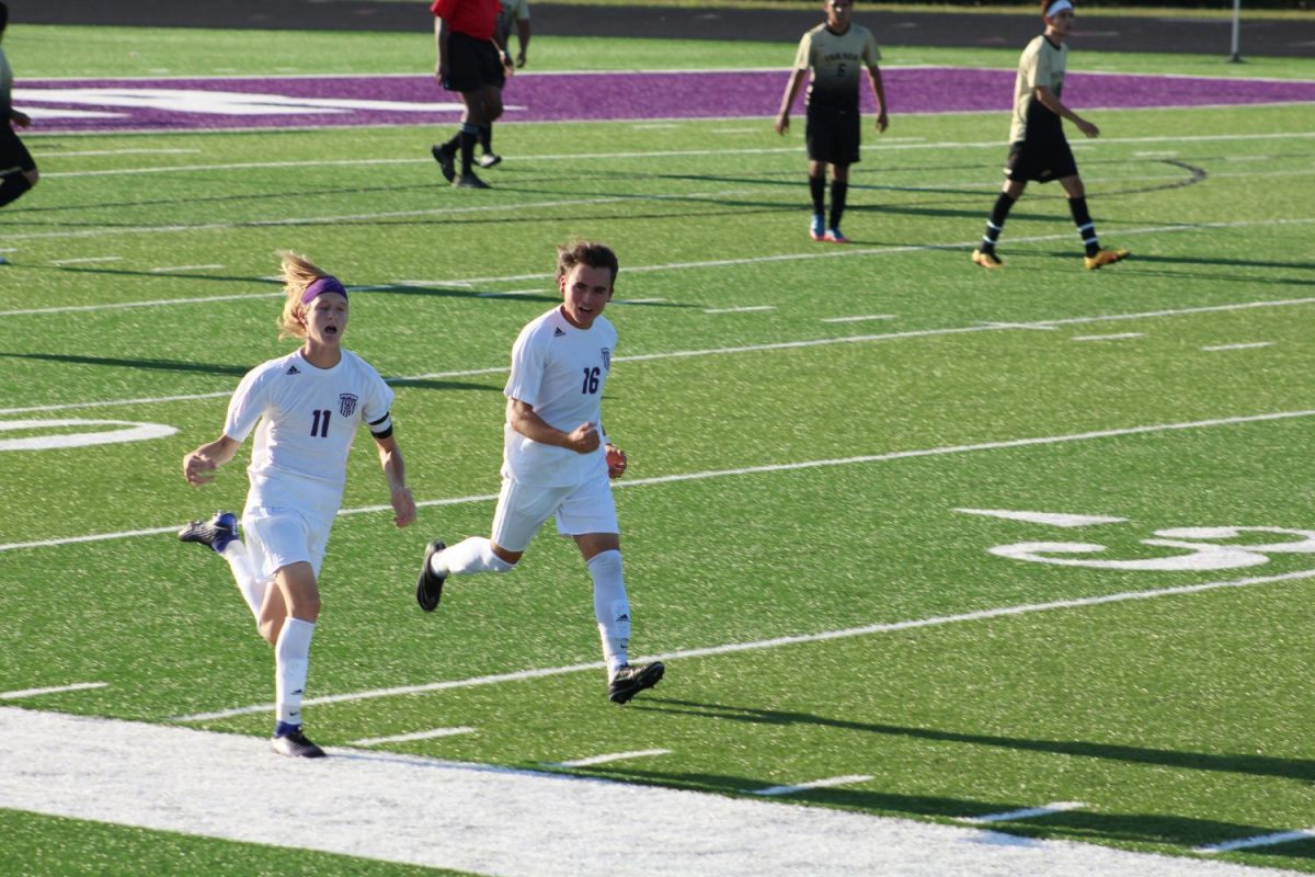 Juniors Ronin Richardson and Kimball Backus celebrate after Richardson scored a goal.  The Pirates won, 3-0.