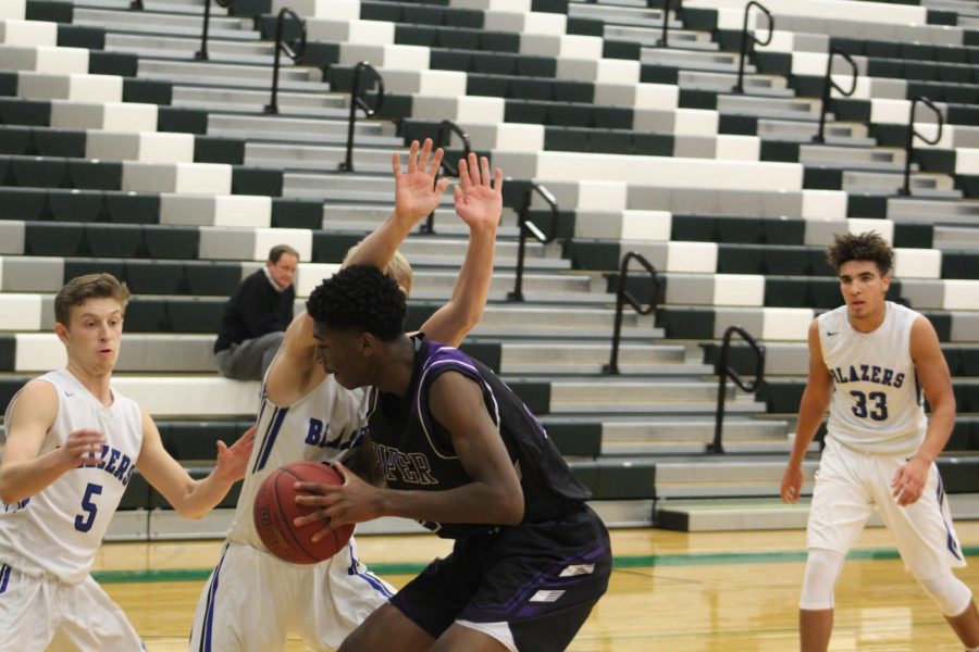 Junior Brandan Jackson goes up for layup with heavy contest.