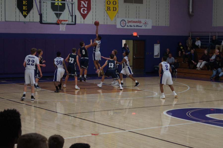 Sophomore Christian Arndt attempts to score to extend the Pirates' lead against Hayden Dec. 12.