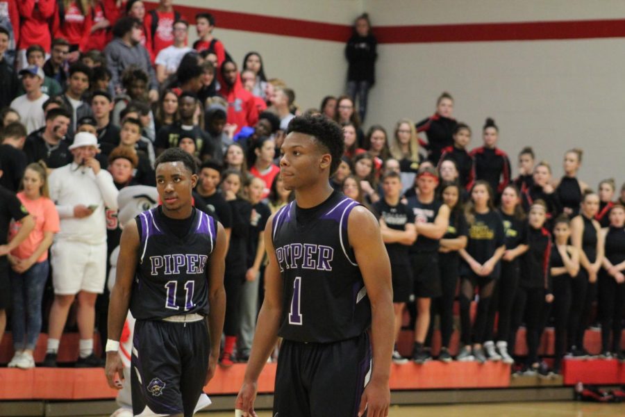 Senior Doc Covington and Junior Trey Bates begin to get back from free throw conversion.