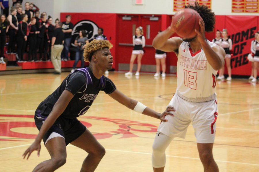 Junior Braijion Barnes plays defense against Ottawa player.