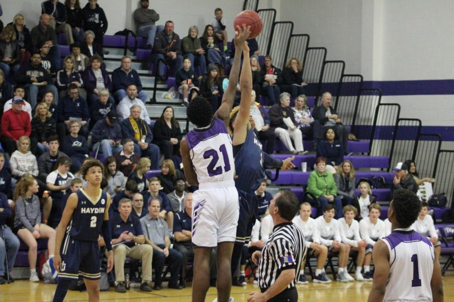 Junior Brandan Jackson goes up for tip-off.