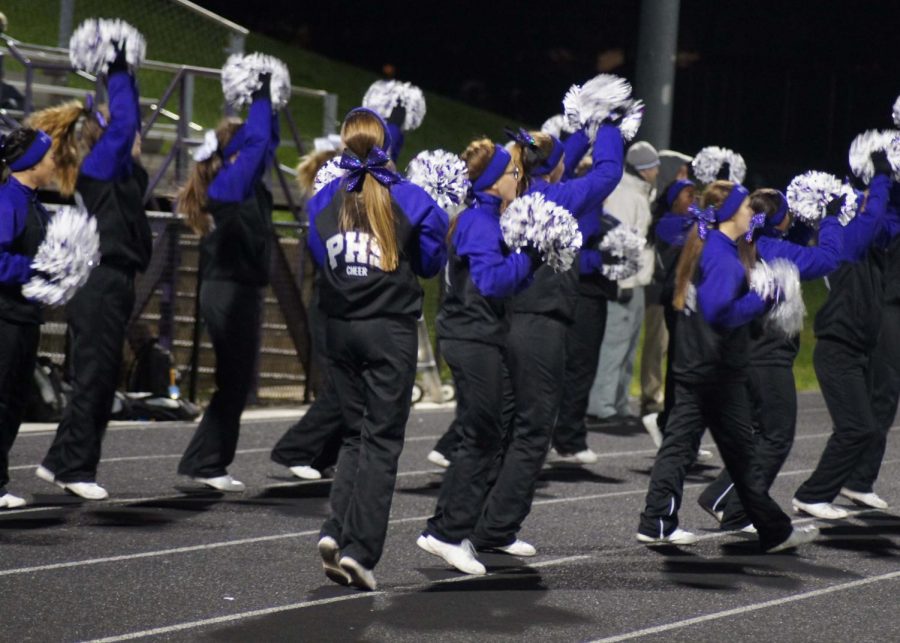 The PHS cheerleaders celebrate as the Pirates score a touchdown.  The Pirates won 47-20 against Atchison.