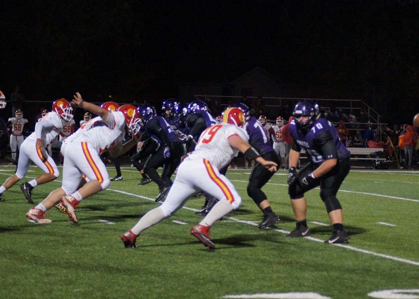 Piper blocks Atchison from going down the field, determined not to let them score a touchdown.