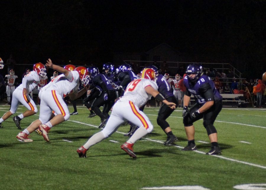 Piper blocks Atchison from going down the field, determined not to let them score a touchdown. 