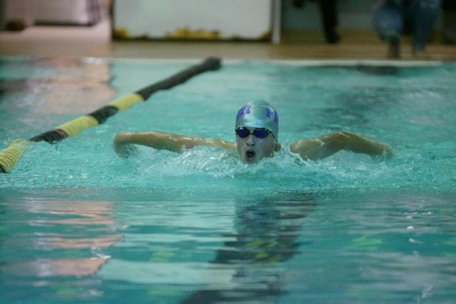 Junior Zane Howell swimming 100m Fly at Turner High School.