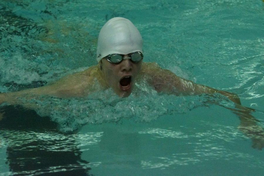 Sophomore Carson Gardner swimming 100m Breast Stroke at Turner High School. 