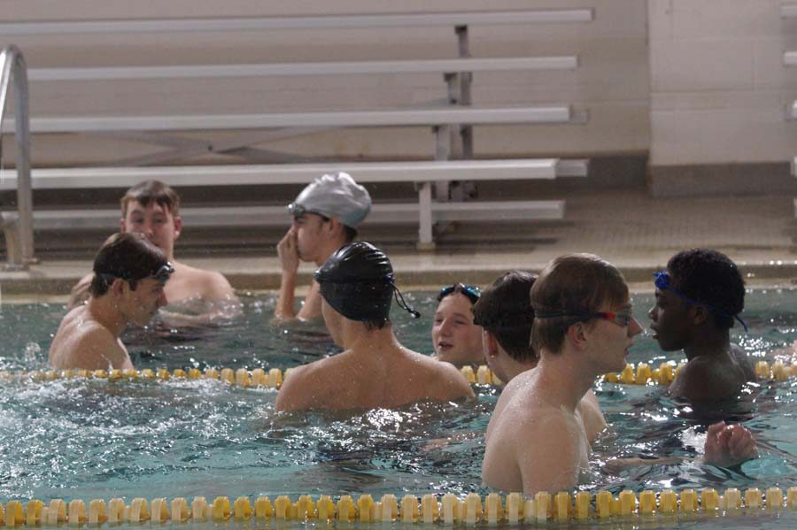Piper Boys Swim Team warming up before the meet at Washington High School.