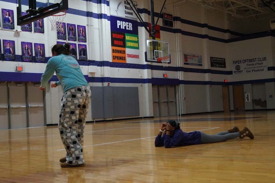 Seniors Kara Evans and Daijah Jones perform a impromptu duo about playing tag in the woods with an axe murderer.