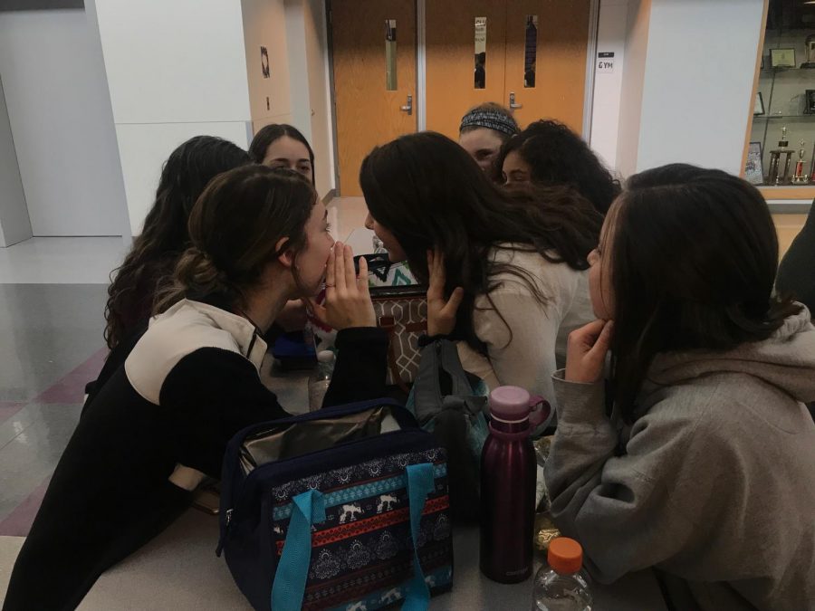 Students converse about news during lunch time.