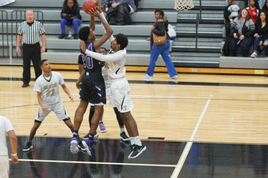 Junior Brandan Jackson jumps up to shoot and scores another basket for the Pirates. 