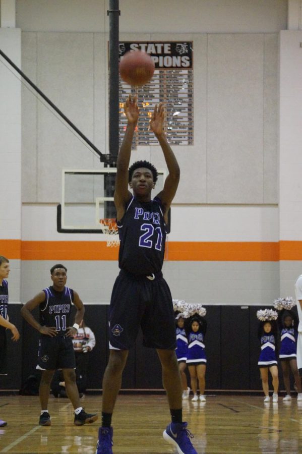 Junior Brandan Jackson shoots a free throw to gain a point for the Pirates Jan. 12.