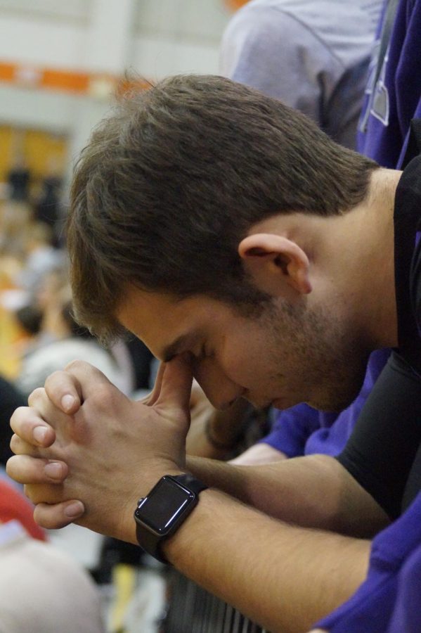 Senior Ryan Bach bows his head in defeat after the Pirates lose against the Braves.