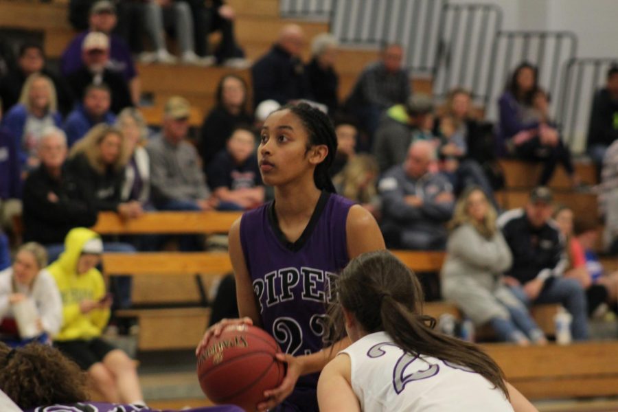 Junior Ryan Cobbins focuses while shooting her free-throws to close out the game.