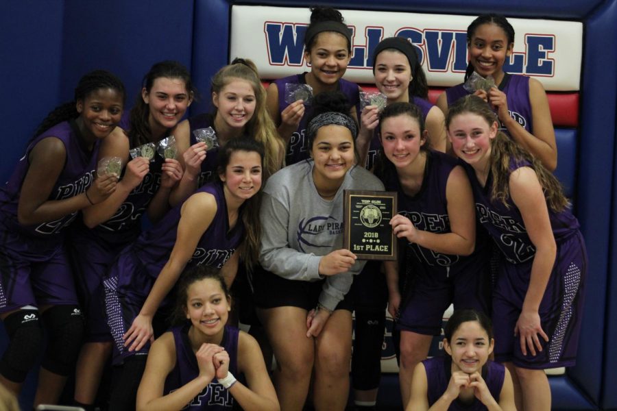 Lady Pirates share laughs and smiles after their championship win against Baldwin.