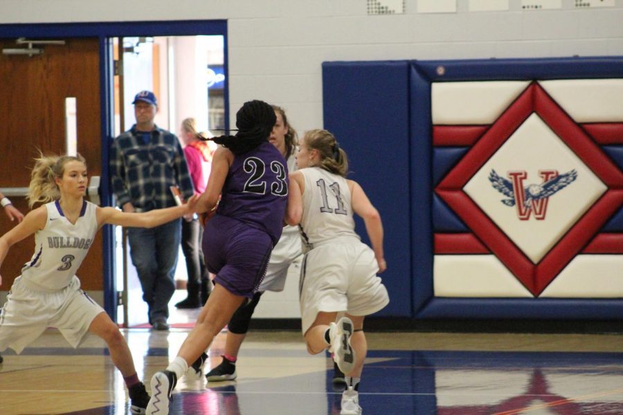 Junior Ryan Cobbins gets fouled while going through the lane for a basket.