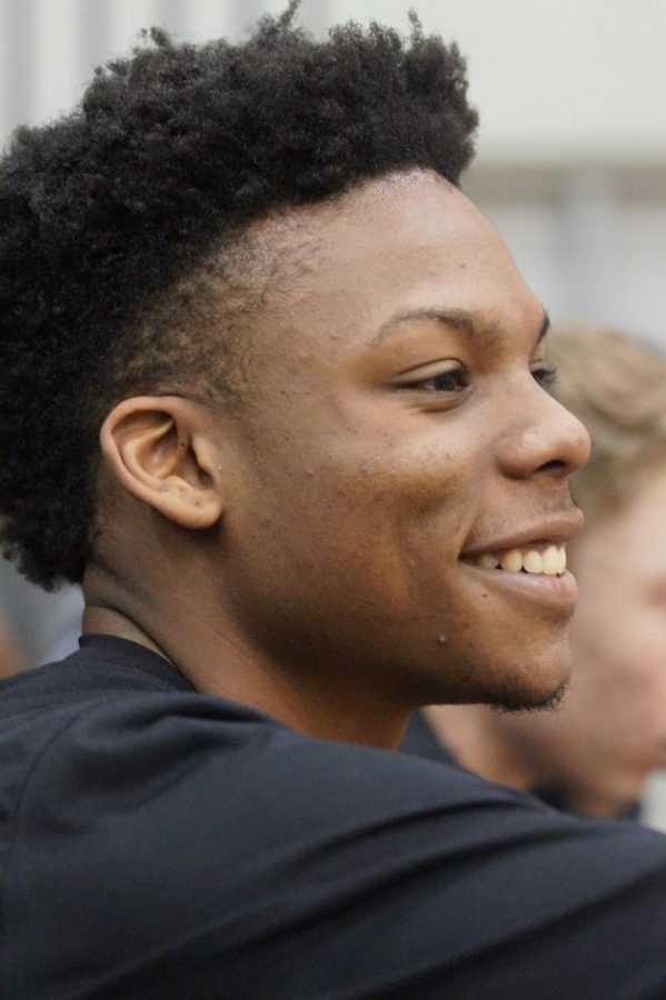 Senior Daviance Covington smiles after the varsity girls score against Bonner.