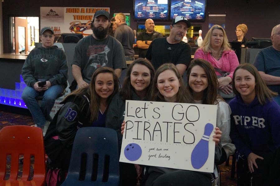 The girls team showed up early to the boys game to show their support before competing that afternoon.