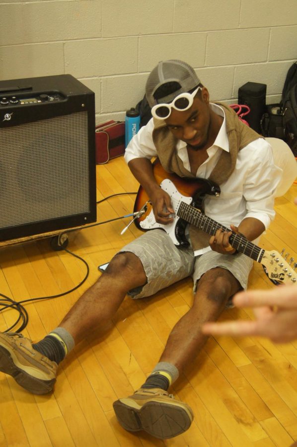 Court-warming candidate Isaiah Washington practices his talent before the pep rally on February 9.