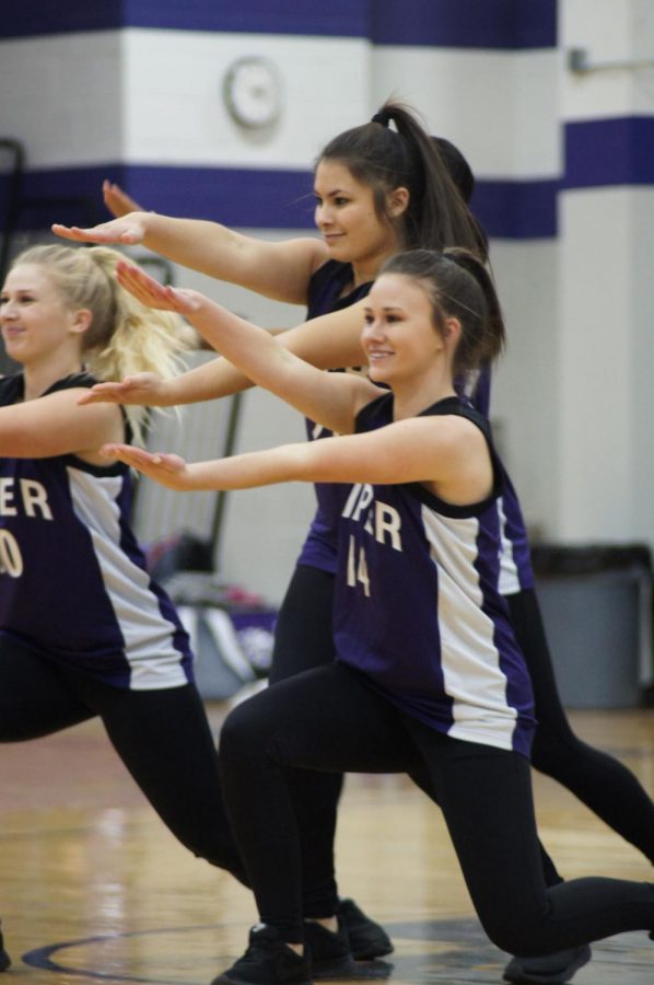 Senior Aubree Knetter and juniors Calleigh Gardner and Taylor McEachron dance at the pep rally on Feb. 9