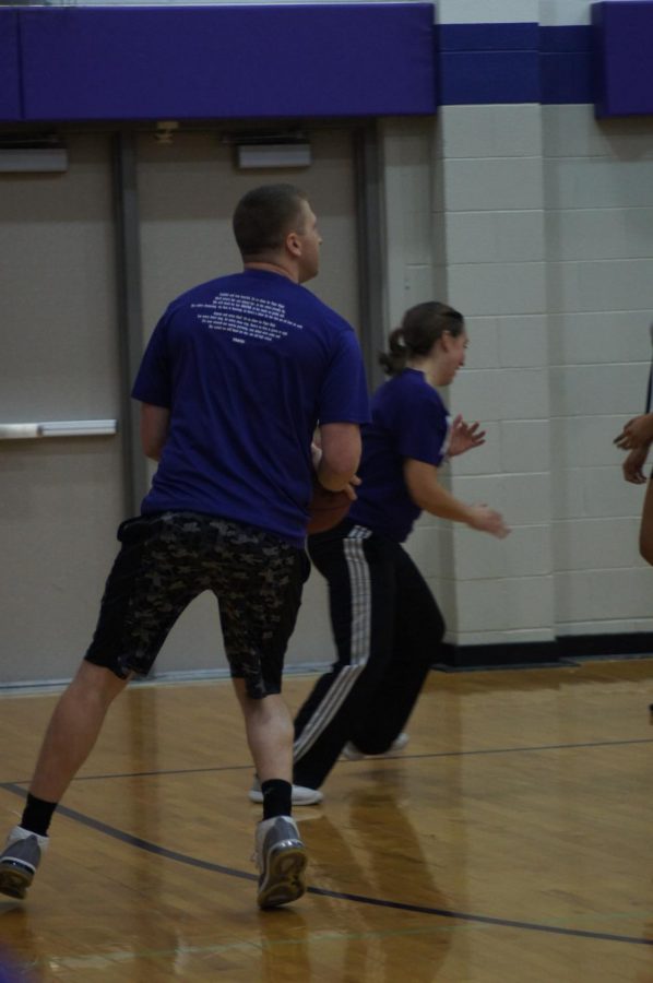 Vice Principal John Tytla prepares to shoot a basket at the teacher vs. teacher basketball game. Tytla air-balled the shot shortly after. 