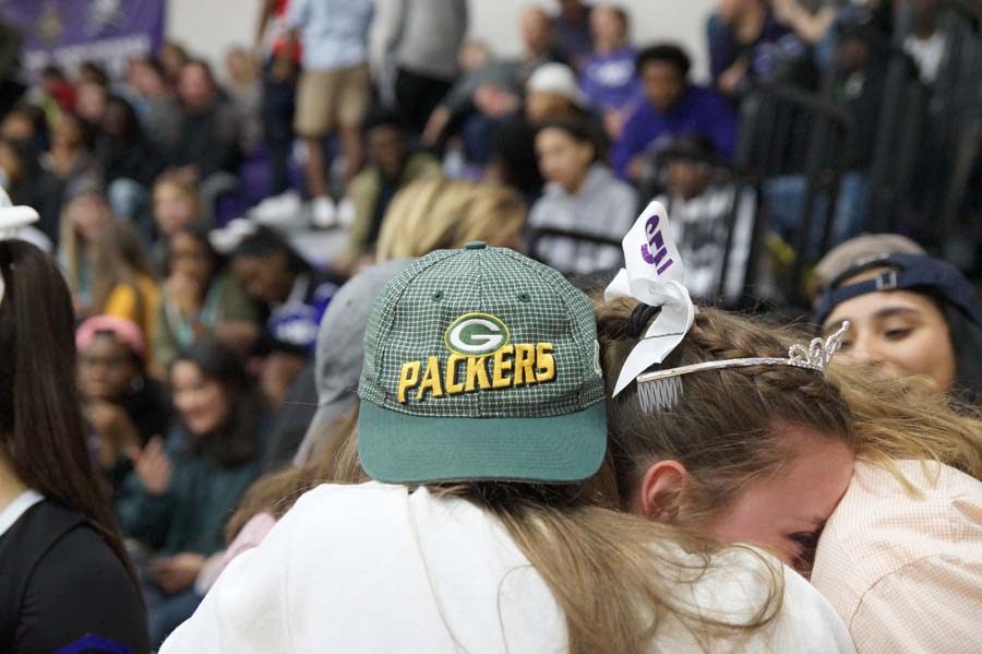 With an after congratulation the crowd surrounds Sophia Frick. Senior Mallory Holt hugs Frick  along with some other crowd members who were thrilled for Frick.