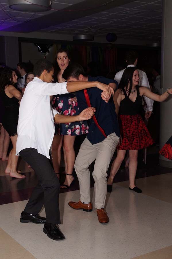 Students dance at courtwarming while impressing the surrounding students.