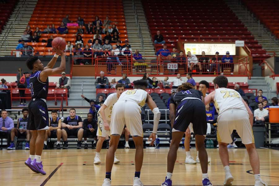 Senior Doc Covington makes a free throw shot after being fouled by Andover Central. In the second half making the crowd erupt with joy of the close game.